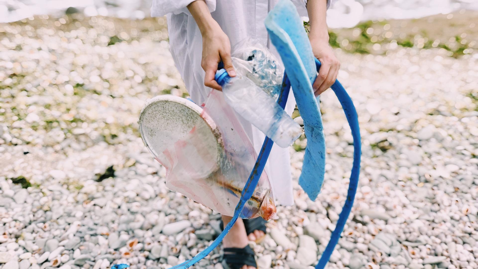Person Holding Plastic Bottle.jpg